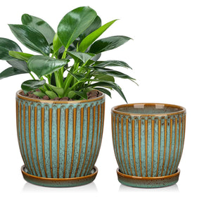 Oairse ceramic pot with line stripes in bluish-grey glaze, ideal for small plants.