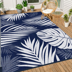 Ogrmar reversible outdoor rug in blue and white on patio for versatile styling