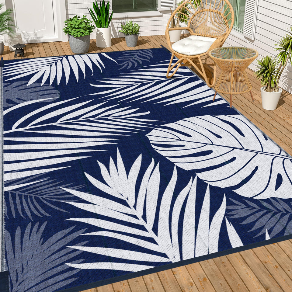 Ogrmar reversible outdoor rug in blue and white on patio for versatile styling