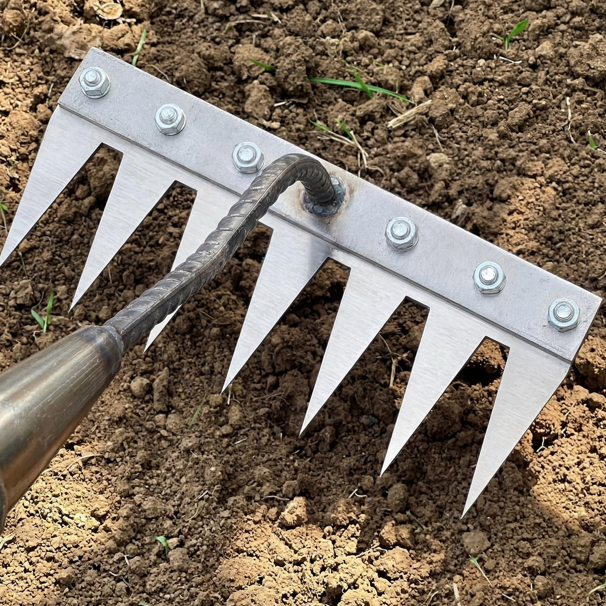 Oh Klyzo gloves and rake pack protects hands during weeding.
