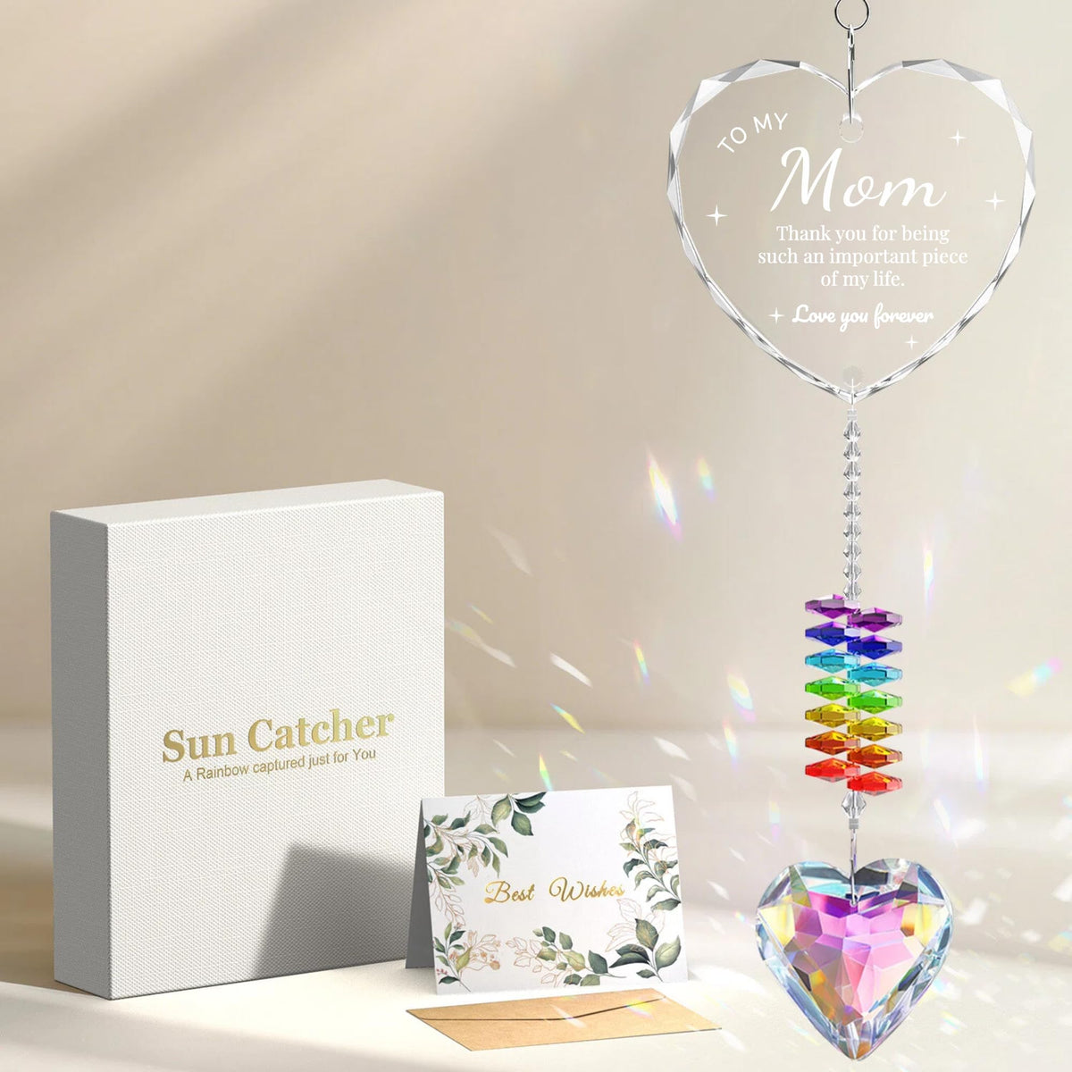 Oikomai K9 crystal sun catcher heart front catching sunlight to cast rainbows.