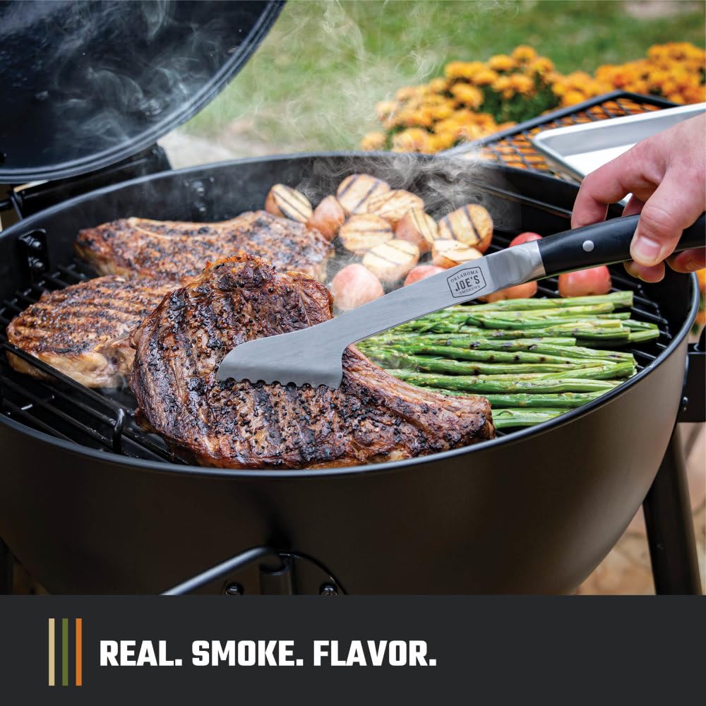 Oklahoma Joe's Blackjack hinged lid for quick checks while cooking