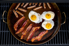 Oklahoma Joe's griddle surface close-up shows durable carbon steel for fast, even heating