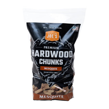 Oklahoma Joe's Mesquite wood chunks in bag for even smoking and bold Texas-style flavor.