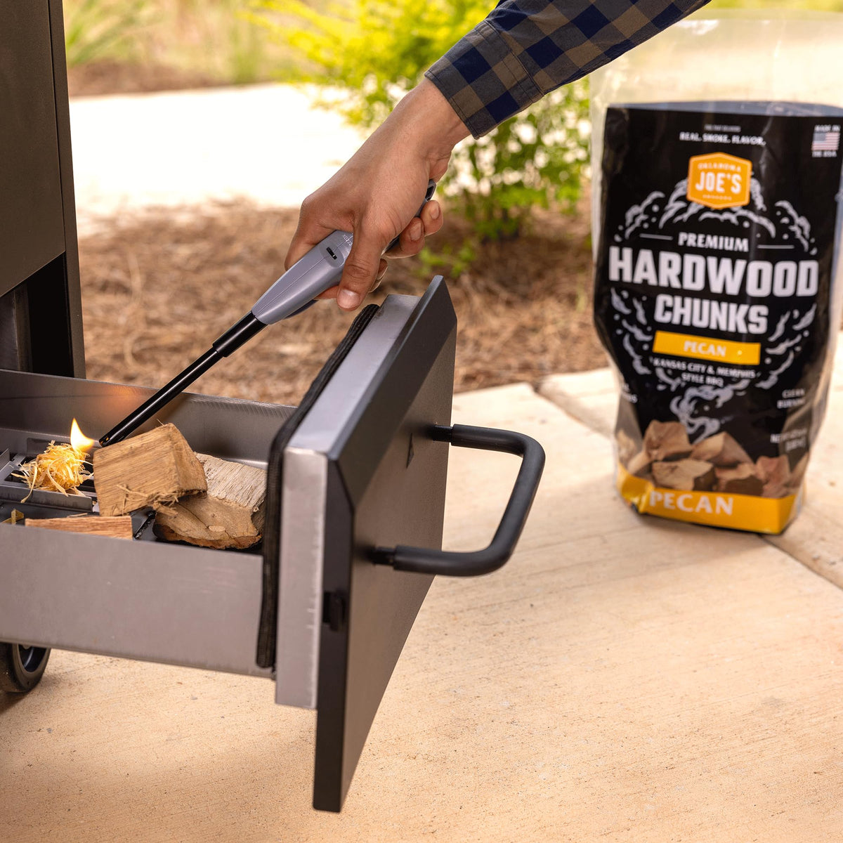 Oklahoma Joe's Pecan Wood Chunks packaging signals premium hardwood for smoking.
