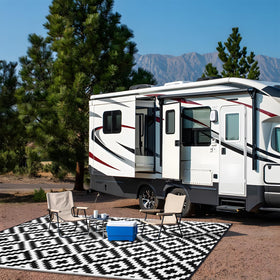 OLANLY black and white rug complements modern outdoor spaces.