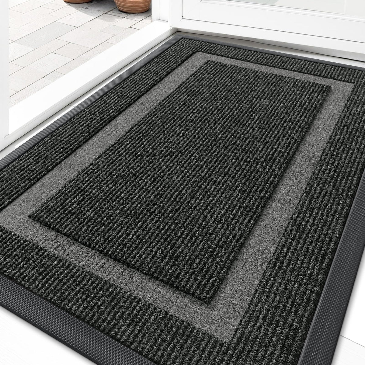 OLANLY front door mat shows ultra-thin profile gliding under a door for easy entry.