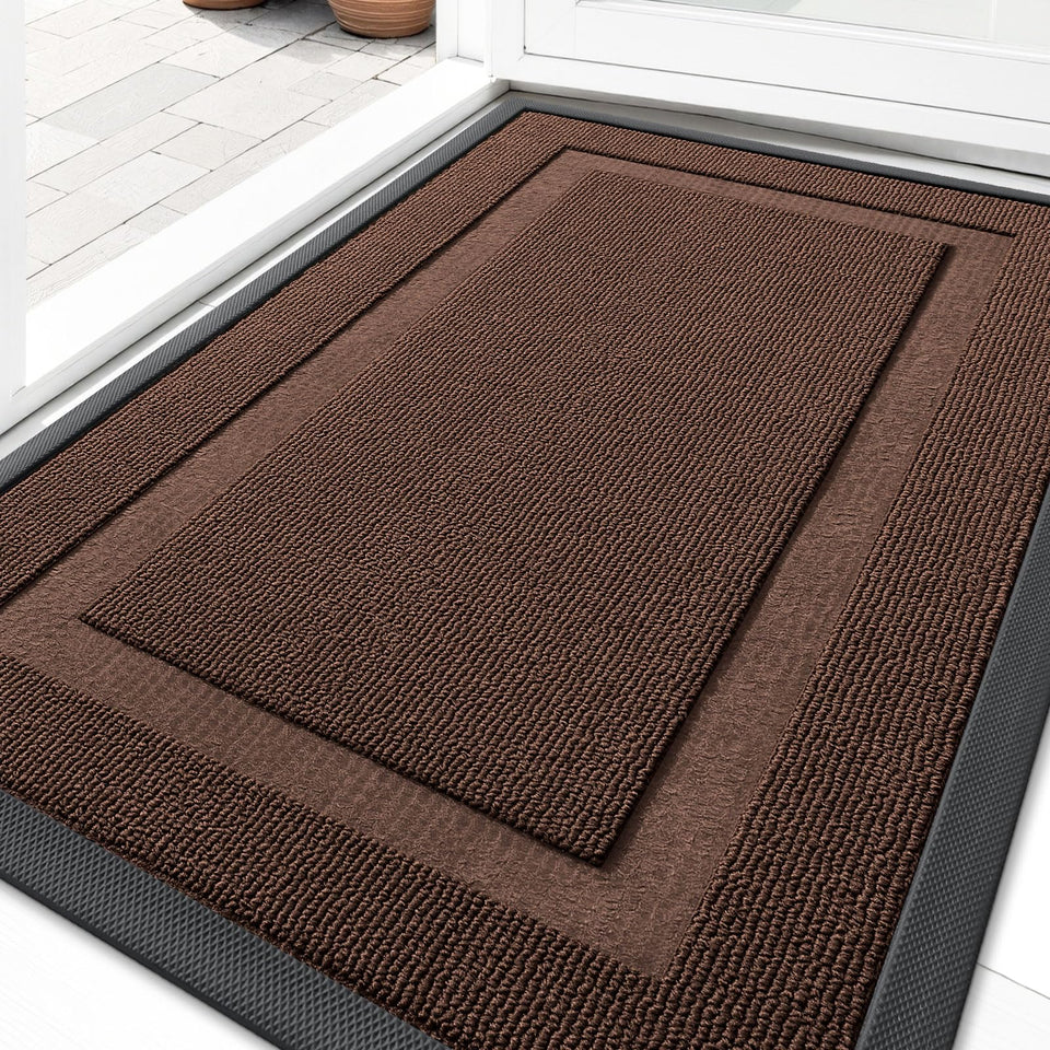 OLANLY front door mat with slender profile fits under doors while catching dirt