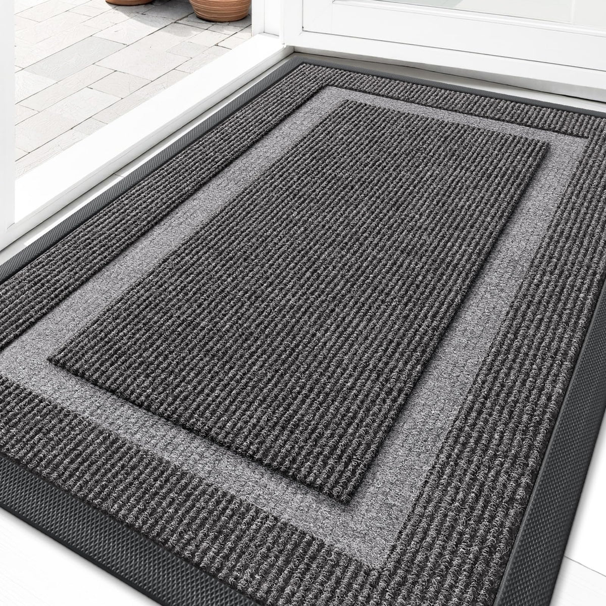 OLANLY front door mat under the door with slim clearance for easy passage.
