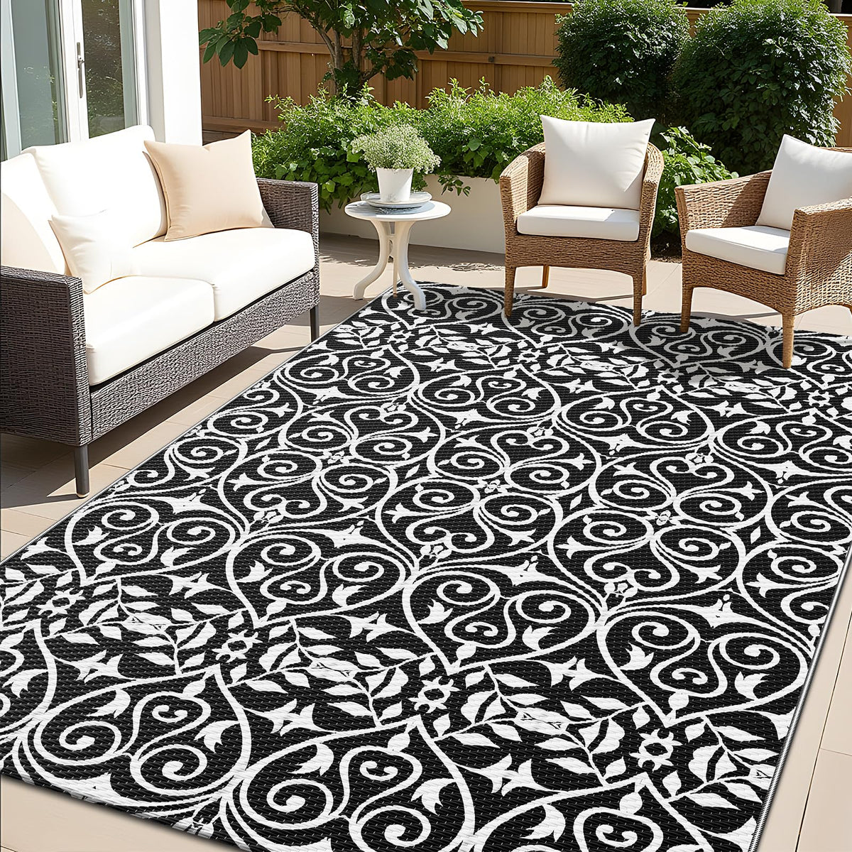 OLANLY outdoor rug with floral pattern; quick-clean surface ideal for patios and decks.