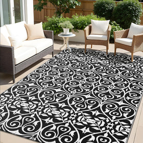 OLANLY outdoor rug with floral pattern; quick-clean surface ideal for patios and decks.