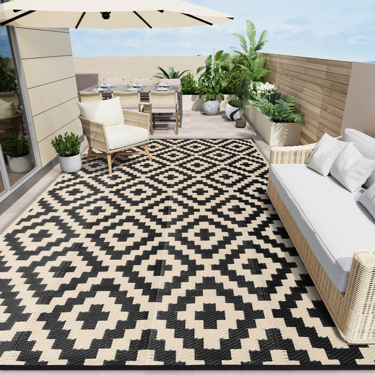 OLANLY waterproof outdoor rug 8x10 in black and beige on a sunny patio