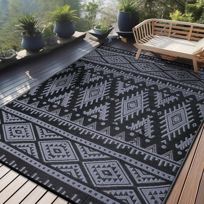 OLANLY outdoor rug 9x12 in black and grey on patio; quick-drying and outdoor-ready