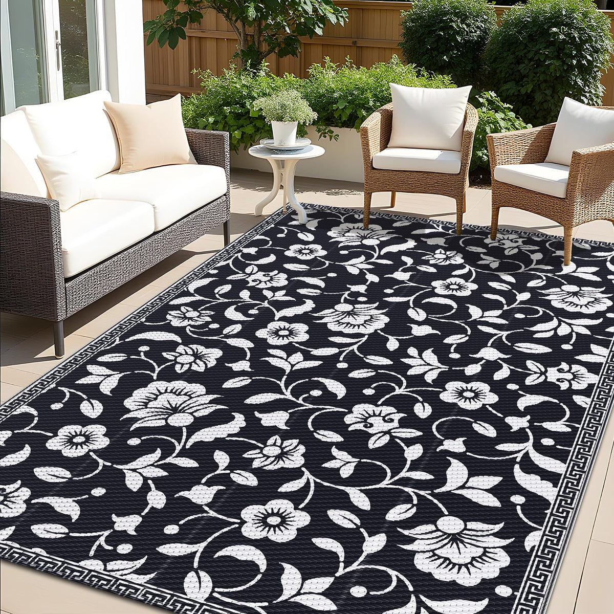 OLANLY 5x8 ft waterproof outdoor rug on patio shows quick-drying and stain resistance.