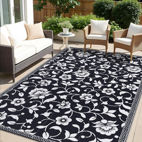OLANLY 5x8 ft waterproof outdoor rug on patio shows quick-drying and stain resistance.