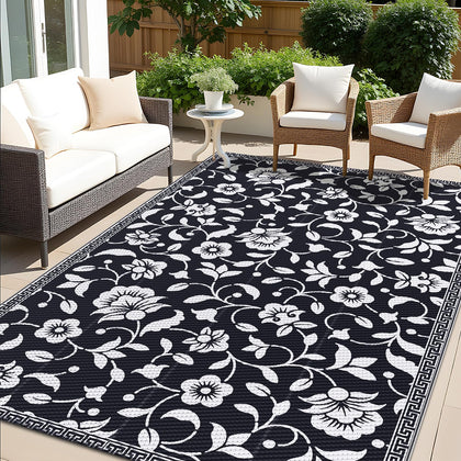 OLANLY 5x8 ft waterproof outdoor rug on patio shows quick-drying and stain resistance.