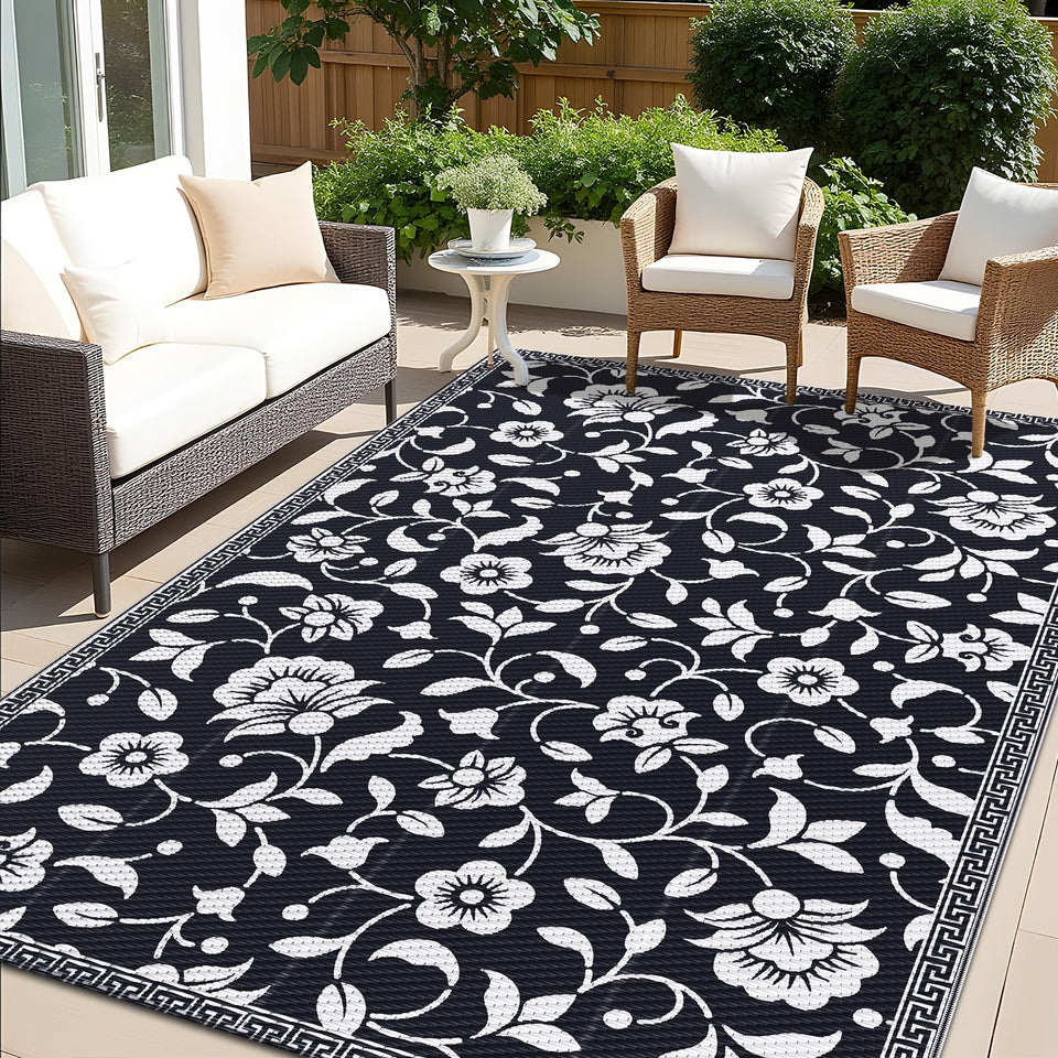 OLANLY 5x8 ft waterproof outdoor rug on patio shows quick-drying and stain resistance.