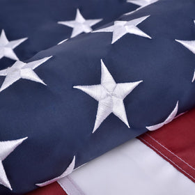 Olynese American flag with embroidered stars on outdoor 4x6 display, durable for year-round use.