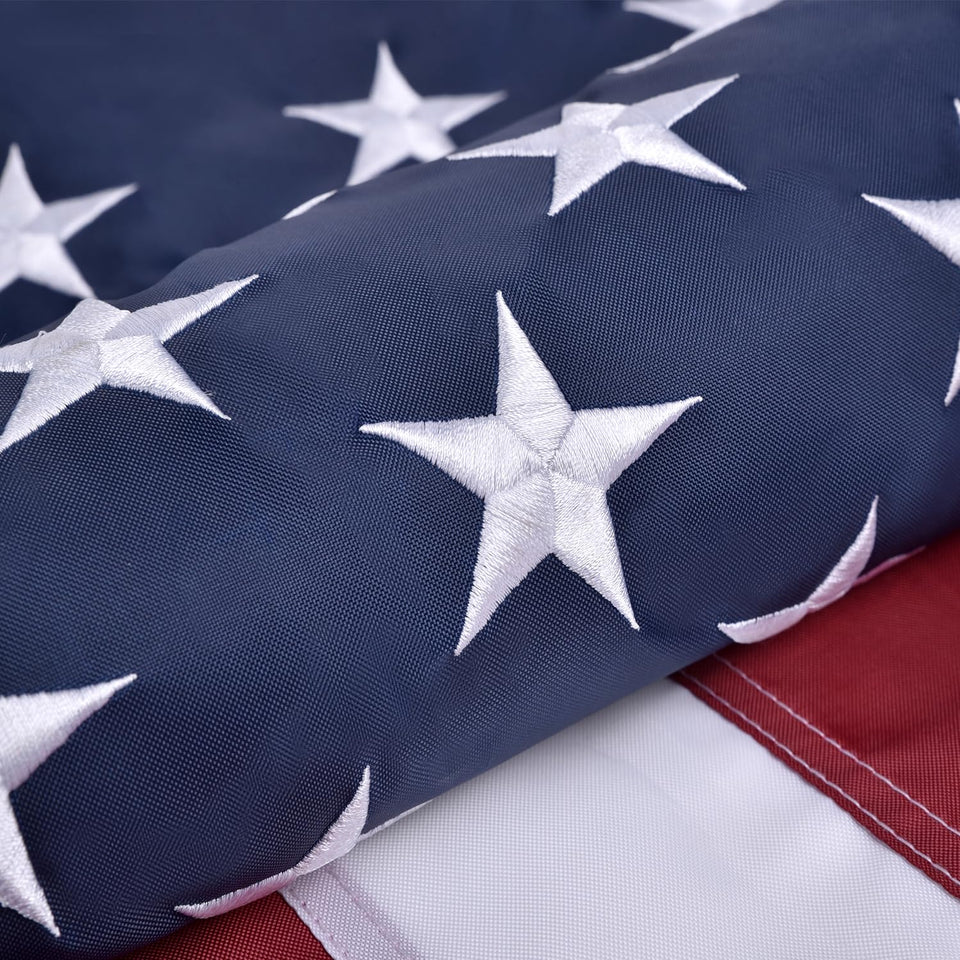 Olynese American flag with embroidered stars on outdoor 4x6 display, durable for year-round use.