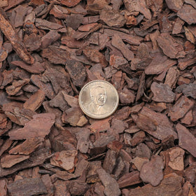 Omitgoter pine bark mulch texture shows natural, durable soil cover.