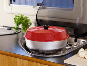 Omnia Oven lid with steam vents—prevents soggy baked goods.