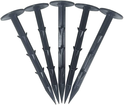 One Stop Outdoor 4in heavy-duty stake securing weed fabric for durable outdoor projects.