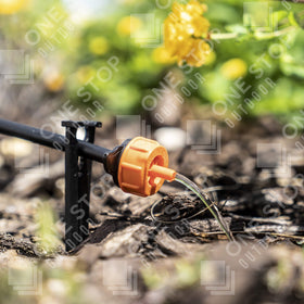 One Stop Outdoor drip emitter installed in garden bed for even watering