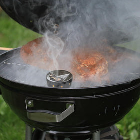 Onlyfire Chef smoker box fills with wood chips for customizable smoky flavor.