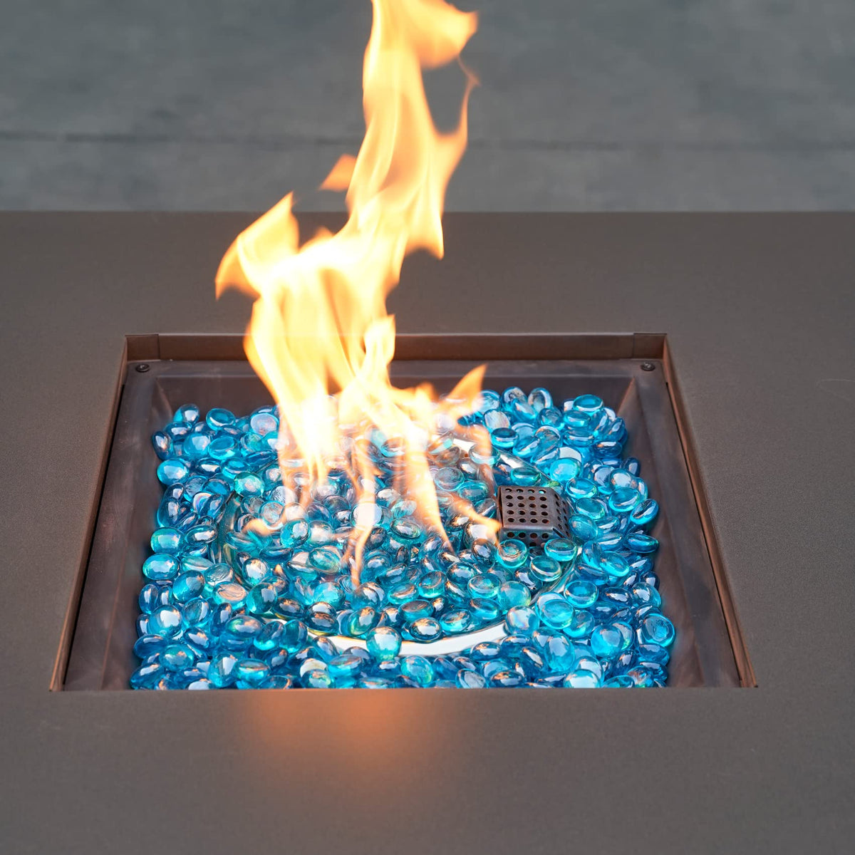 OnlyFire Caribbean Blue blend creates tropical tones around the fire pit.