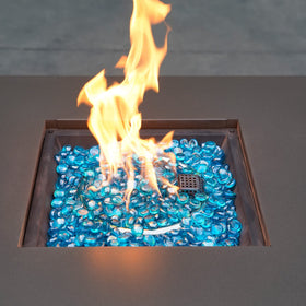 OnlyFire Caribbean Blue blend creates tropical tones around the fire pit.