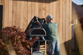 Ooni cover easy-fit full-coverage shown on oven and table.