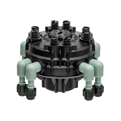 Orbit 3-pack adjustable flow 8-port manifold on 1/4 inch tubing enables even watering across beds.