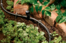 Orbit 67301 100-foot drip blank tubing black spool, ideal for distributing water across garden zones.