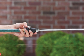 Orbit SunMate shut-off lever demonstrates fingertip flow control on a hose-end nozzle