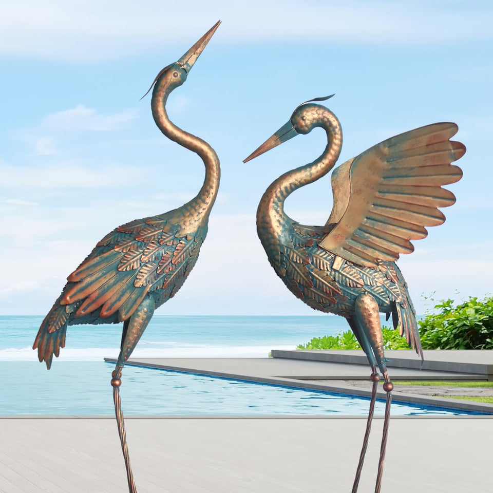 Oritty copper crane garden statue pair adds rustic outdoor decor.