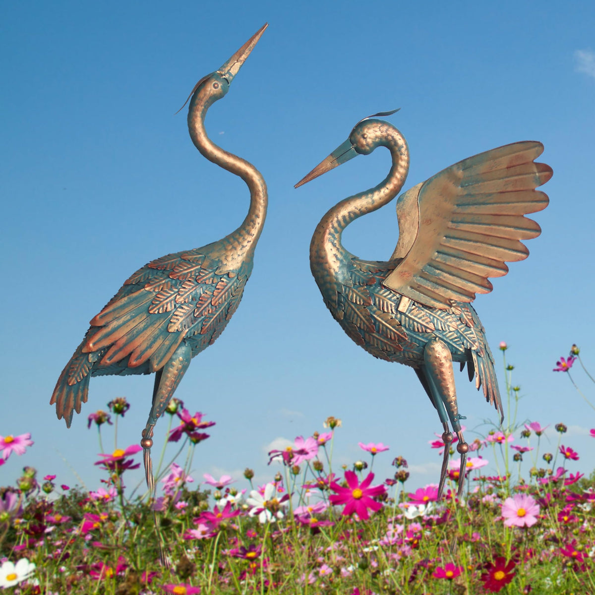 Oritty copper crane statue features hand-painted outdoor-safe finish.