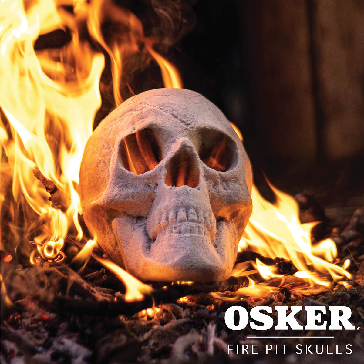 OSKER skull as Halloween decor with fire for spooky ambiance.