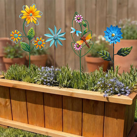 Otoolling dragonfly stake adds playful detail to pathways and pots.