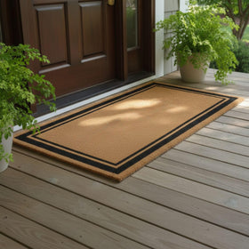 Ottomanson Coco Coir Front-Door Mat demonstrates rugged scraping action for clean entryways.