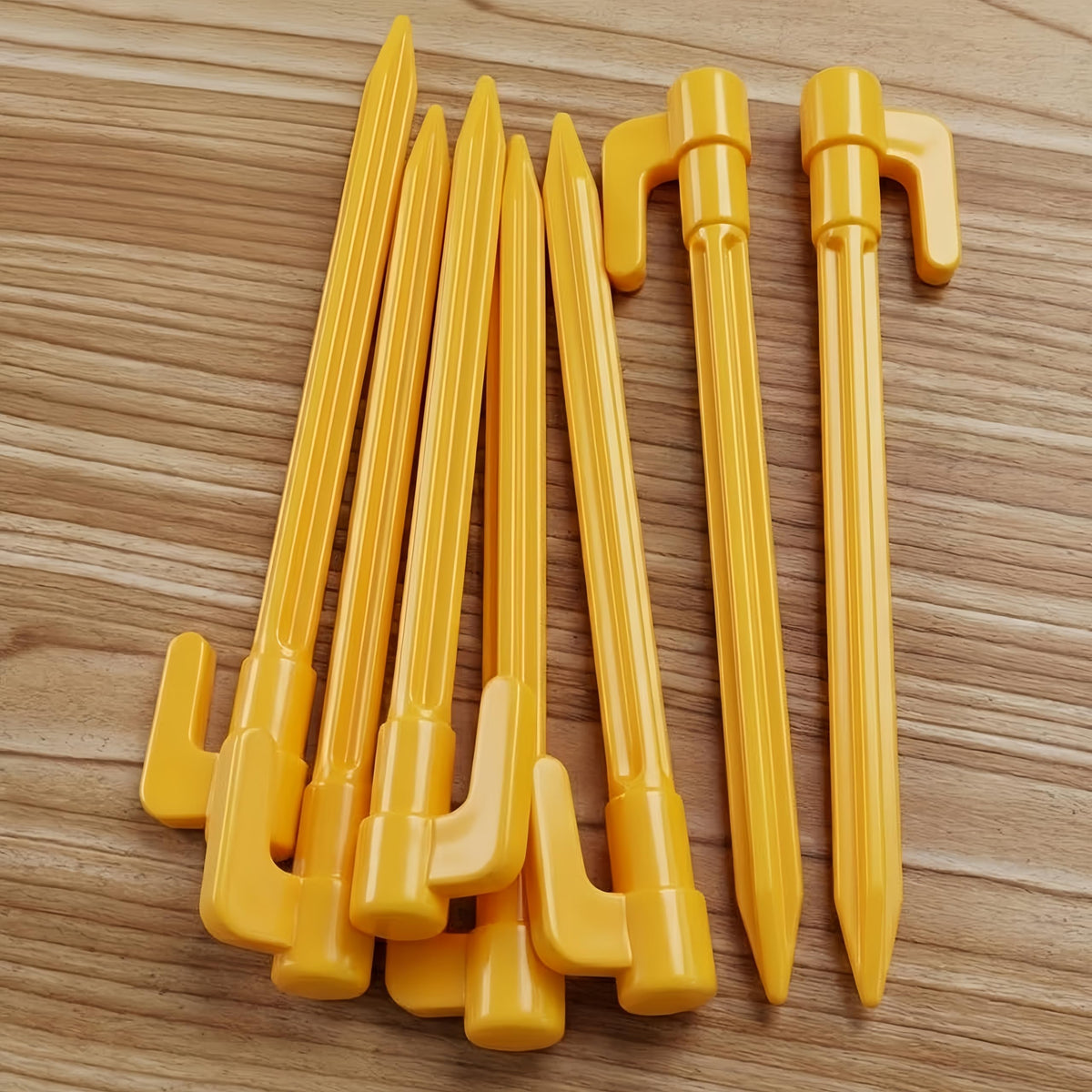 Oualhoo stake close-up showing the yellow hook top for rope security