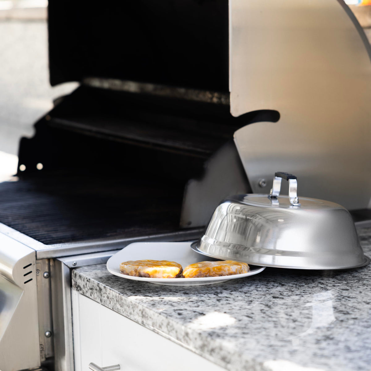 Outset burger-cover dome keeps burgers moist and cooks cheese evenly.