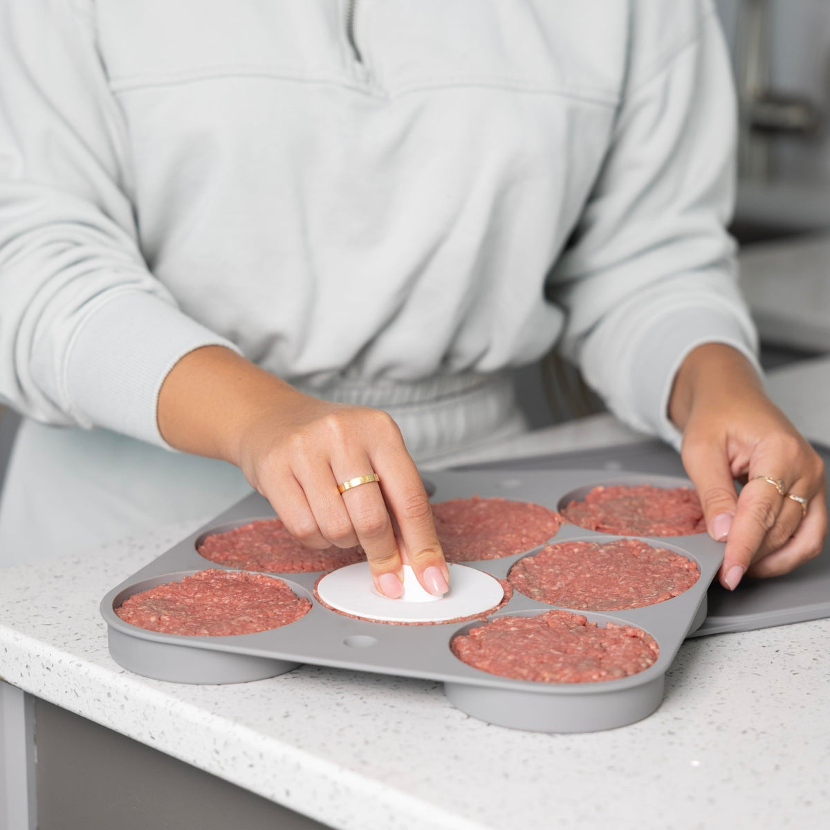 Outset burger patty storage tray stores eight patties for fridge or freezer.