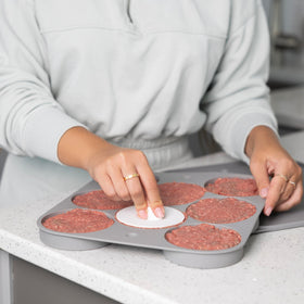 Outset burger patty storage tray stores eight patties for fridge or freezer.