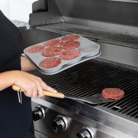 Outset tray setup demonstrates complete burger prep, press, and storage.
