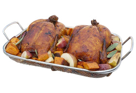 Outset basket filled with vegetables, ideal for outdoor roasting