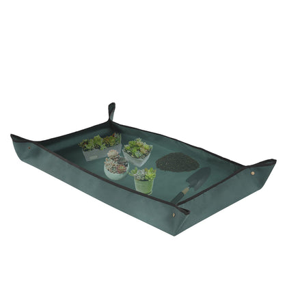 Owl Focus repotting mat folded for compact storage and easy transport.