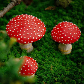 OwMell glow in the dark mushroom used as patio decor after sunset.