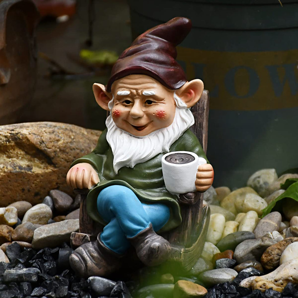 OwMell gnome statue sits on a rocking chair with coffee, perfect for sunny garden corners.