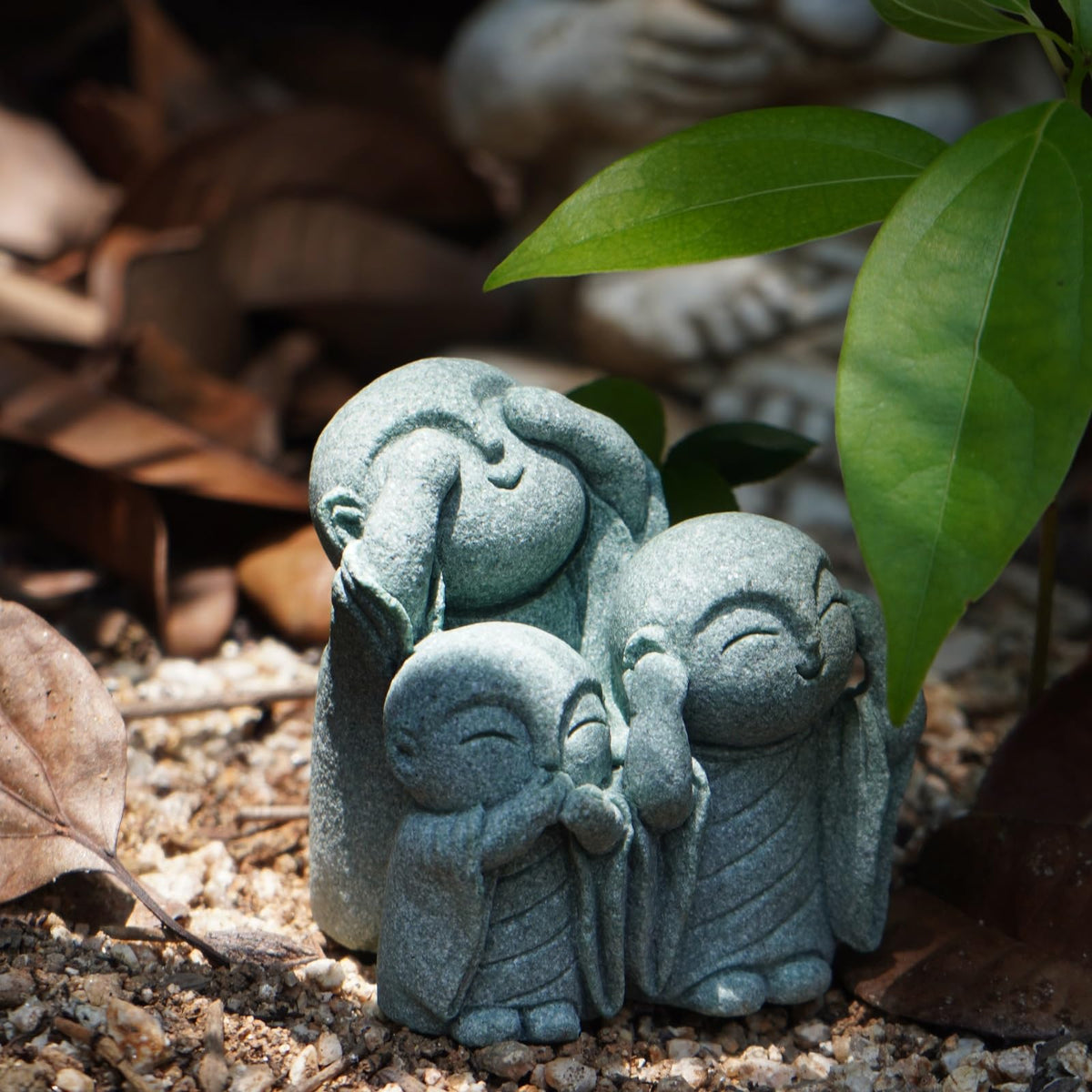OwMell Jizo monk statue trio in garden creates tranquil outdoor charm.