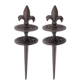 OwnMy cast iron hose guide stake with spear tip pattern protects flower beds during watering.